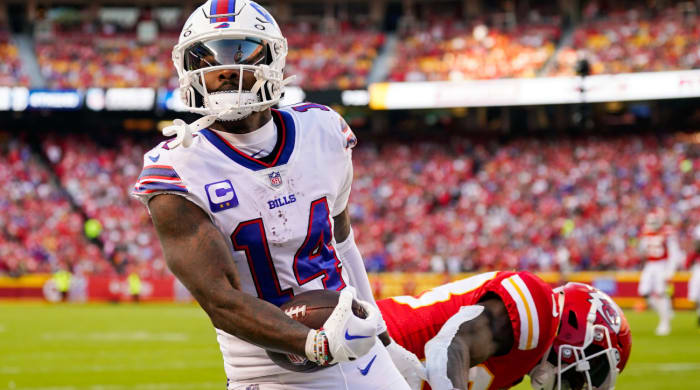 Oct 16, 2022; Kansas City, Missouri, USA; Buffalo Bills wide receiver Stefon Diggs (14) scores a touchdown against Kansas City Chiefs cornerback L’Jarius Sneed (38) during the second half at GEHA Field at Arrowhead Stadium. Mandatory Credit: Jay Biggerstaff-USA TODAY Sports